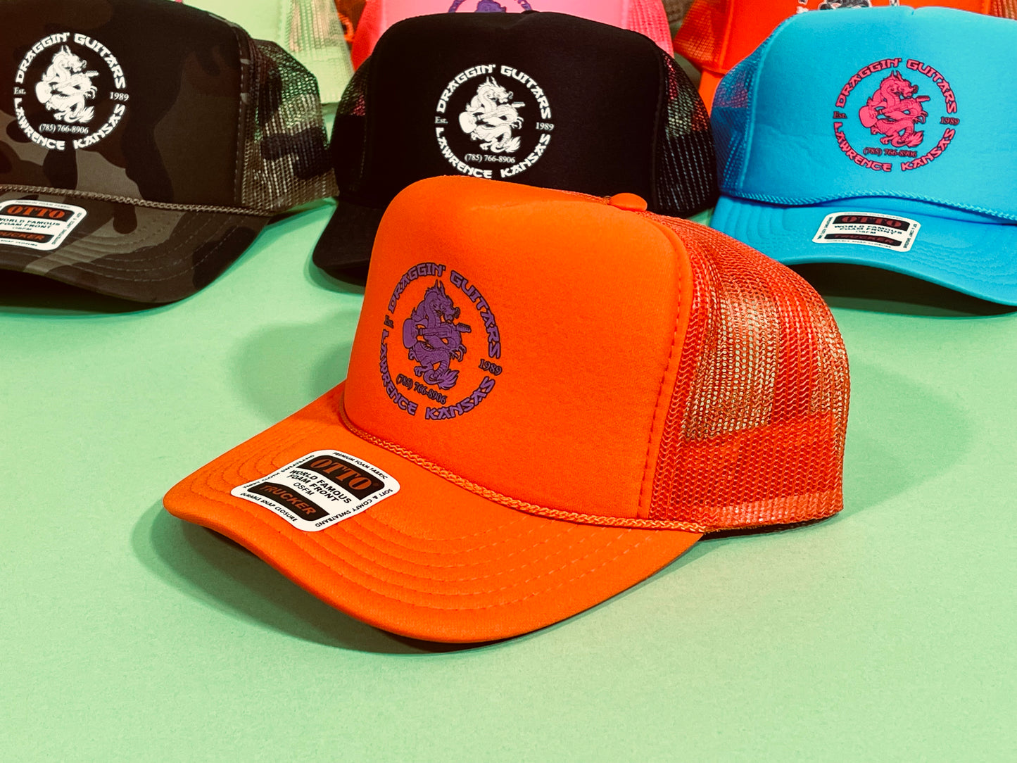 Draggin' Guitars Snap-Back Retro 1970's Trucker Hat Orange with Purple Print
